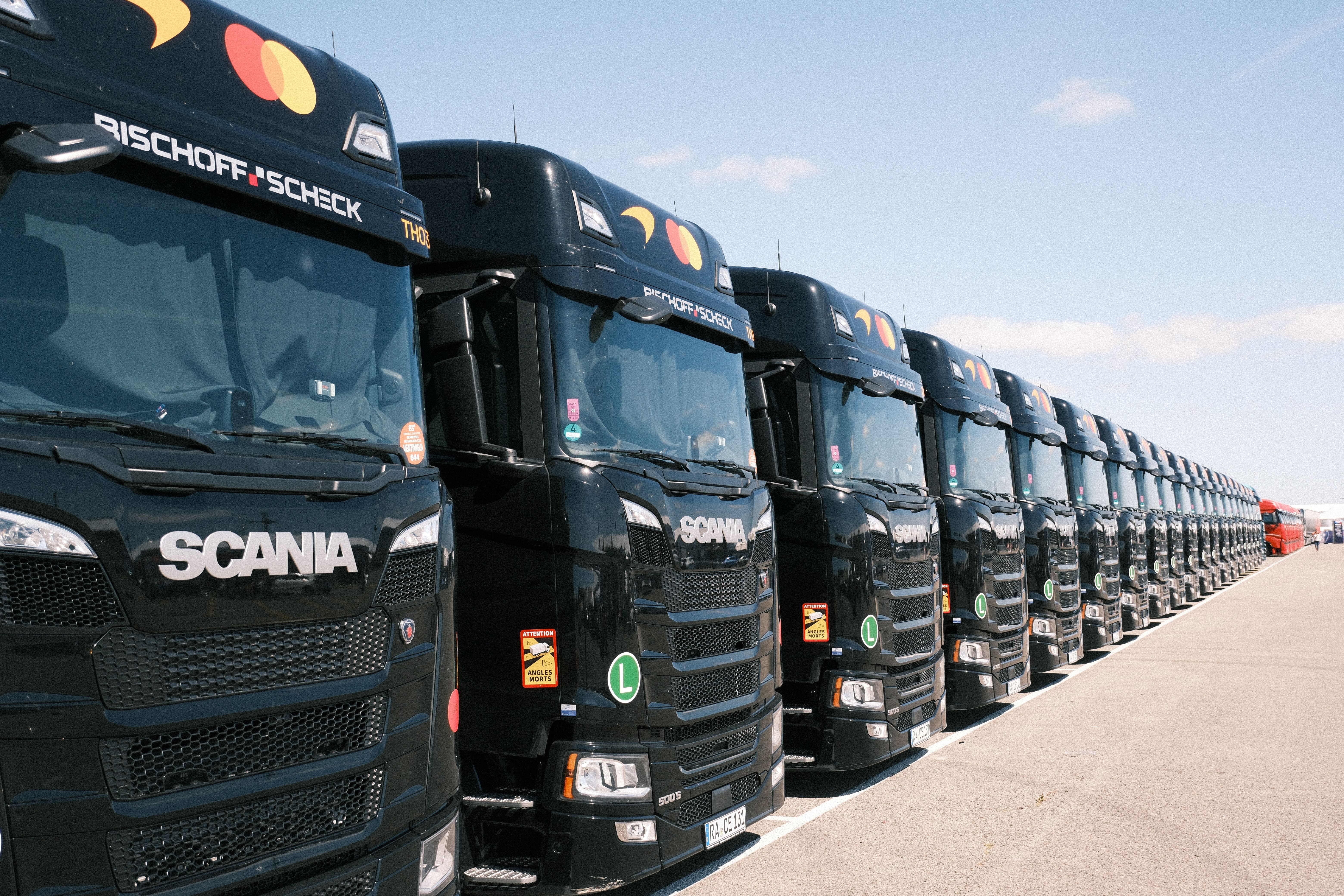 Line-up of trucks at an industry event
